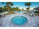 Relaxing spa and pool area with tables, chairs, and lush landscaping at 12307 Blue Hill Trl, Bradenton, FL 34211