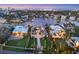 An aerial view shows the neighborhood, waterfront location, and manicured landscaping of this luxury residence at 1333 Vista Dr, Sarasota, FL 34239