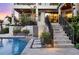 Staircase view of the backyard featuring a pool, stepping stones, and lush tropical landscaping at 1333 Vista Dr, Sarasota, FL 34239