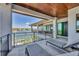 Spacious balcony with stylish seating, a wood-paneled ceiling, and panoramic waterfront views for outdoor enjoyment at 1333 Vista Dr, Sarasota, FL 34239