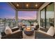 Relaxing balcony featuring comfortable seating around a cozy fire pit, overlooking waterfront views at 1333 Vista Dr, Sarasota, FL 34239