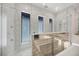 Modern bathroom with a walk-in shower, sleek fixtures, and neutral color palette at 1333 Vista Dr, Sarasota, FL 34239