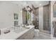 Well-lit bathroom featuring a modern vanity, glass-enclosed shower, and sleek fixtures at 1333 Vista Dr, Sarasota, FL 34239