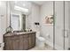 Contemporary bathroom featuring a large mirror, modern vanity, and glass enclosed shower at 1333 Vista Dr, Sarasota, FL 34239
