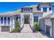 Front entrance with brick stairway, lush landscaping, and a charming exterior elevation at 1333 Vista Dr, Sarasota, FL 34239