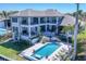 Beautiful multi-story home with pool, spa, and outdoor seating areas, perfect for entertaining at 1333 Vista Dr, Sarasota, FL 34239