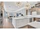 Open-concept kitchen with a large island overlooking the living area at 1333 Vista Dr, Sarasota, FL 34239