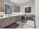 Functional laundry room with modern appliances, ample counter space, and a sleek design at 1333 Vista Dr, Sarasota, FL 34239