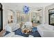 Bright living room with unique light fixture, wine storage, and modern furnishings at 1333 Vista Dr, Sarasota, FL 34239