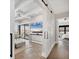 Bright living room featuring a sliding barn door and hardwood floors, perfect for entertaining and relaxation at 1333 Vista Dr, Sarasota, FL 34239