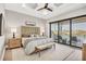 Inviting main bedroom with a woven headboard, balcony access, and serene water views at 1333 Vista Dr, Sarasota, FL 34239
