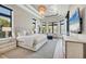 Luxurious main bedroom featuring a tray ceiling, bay windows, and elegant decor at 1333 Vista Dr, Sarasota, FL 34239