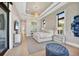 Stylish main bedroom with tray ceiling, modern furniture, and waterfront view at 1333 Vista Dr, Sarasota, FL 34239