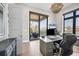 Stylish home office with water views, a built-in desk, and a comfortable seating area at 1333 Vista Dr, Sarasota, FL 34239