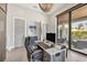 Bright office space with backyard views, a comfortable leather chair, and built in storage at 1333 Vista Dr, Sarasota, FL 34239
