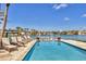 Relaxing backyard pool area with lounge chairs overlooking tranquil waterfront views at 1333 Vista Dr, Sarasota, FL 34239