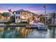 Beautiful waterfront home featuring a private dock, sparkling pool, and manicured lawn at 1333 Vista Dr, Sarasota, FL 34239