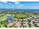 Aerial view showcases the community's golf course, lakes, and beautifully landscaped properties at 13708 Red Rock Pl, Lakewood Ranch, FL 34202