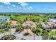 Aerial view of estate showcasing the tile roof, landscaping, paver driveway, and circular driveway at 13708 Red Rock Pl, Lakewood Ranch, FL 34202