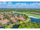 Panoramic aerial view of the community and golf course with lush greenery and lakes at 13708 Red Rock Pl, Lakewood Ranch, FL 34202