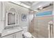 Bright bathroom featuring a glass-enclosed shower, modern fixtures, and neutral tones at 13708 Red Rock Pl, Lakewood Ranch, FL 34202