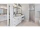 Bathroom with white cabinetry, granite countertops, double sinks, vanity, and a separate shower at 13708 Red Rock Pl, Lakewood Ranch, FL 34202