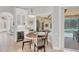 Cozy breakfast nook with a round table, seating for four, and views of the patio at 13708 Red Rock Pl, Lakewood Ranch, FL 34202