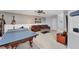 Game room featuring a ping pong table, comfortable seating, and entertainment center at 13708 Red Rock Pl, Lakewood Ranch, FL 34202