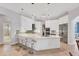 Spacious kitchen island with seating, modern appliances, and ample storage at 13708 Red Rock Pl, Lakewood Ranch, FL 34202