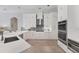 Well-appointed kitchen with white cabinets, modern appliances, and stylish backsplash at 13708 Red Rock Pl, Lakewood Ranch, FL 34202