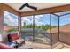 Inviting screened lanai with comfortable seating, offering views of the pool and lush landscaping at 13708 Red Rock Pl, Lakewood Ranch, FL 34202