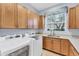 Well-equipped laundry room with ample cabinet space, modern appliances, and natural light at 13708 Red Rock Pl, Lakewood Ranch, FL 34202