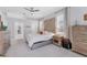 Cozy bedroom features unique headboard, side tables, and a neutral color palette at 13708 Red Rock Pl, Lakewood Ranch, FL 34202