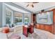 Office featuring a built-in workstation, a bay window with seating, and tranquil water views at 13708 Red Rock Pl, Lakewood Ranch, FL 34202
