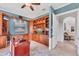 Stylish office featuring custom built-in shelves, desk, and plenty of natural light at 13708 Red Rock Pl, Lakewood Ranch, FL 34202