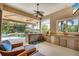 Entertain in style at this outdoor kitchen with pool views, bar, sink, grill, and counter space at 13708 Red Rock Pl, Lakewood Ranch, FL 34202