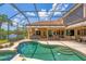 Enjoy the beautiful screened-in pool and outdoor living area, complete with a spa and comfortable seating at 13708 Red Rock Pl, Lakewood Ranch, FL 34202