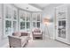 Sitting area featuring shuttered windows and access to lanai at 13708 Red Rock Pl, Lakewood Ranch, FL 34202