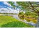 Scenic water view showcasing the lush landscape surrounding the property at 13708 Red Rock Pl, Lakewood Ranch, FL 34202