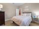 Cozy bedroom with natural light and neutral tones at 13955 Pine Woods E Ln, Sarasota, FL 34240