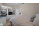 Comfortable bedroom with a built-in entertainment center and abundant natural light at 13955 Pine Woods E Ln, Sarasota, FL 34240