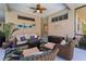 Relaxing outdoor living area with comfortable seating and charming decorative accents at 13955 Pine Woods E Ln, Sarasota, FL 34240