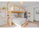 Playful bedroom featuring a bunk bed, plush carpet, and adjacent closet for ample storage at 16768 San Edmundo Rd, Punta Gorda, FL 33955