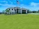 Well-maintained single-Gathering home with a three-car garage, a large lawn, and mature landscaping at 16768 San Edmundo Rd, Punta Gorda, FL 33955