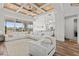 Bright living room features a wood-paneled ceiling, large sectional sofa, and expansive outdoor views at 16768 San Edmundo Rd, Punta Gorda, FL 33955