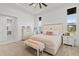 Elegant main bedroom with a neutral color palette, stylish furniture, and cozy textures for a relaxing retreat at 16768 San Edmundo Rd, Punta Gorda, FL 33955