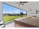 Large screened patio with a hot tub overlooking manicured lawn at 16768 San Edmundo Rd, Punta Gorda, FL 33955