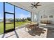 Covered patio with brick flooring and a backyard view, complete with outdoor dining set at 16768 San Edmundo Rd, Punta Gorda, FL 33955