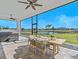 Screened patio with outdoor dining, hot tub and scenic view of the lake and community at 16768 San Edmundo Rd, Punta Gorda, FL 33955