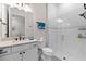 Modern bathroom featuring a walk-in shower, vanity, and neutral color palette at 17916 Northwood Pl, Lakewood Ranch, FL 34202